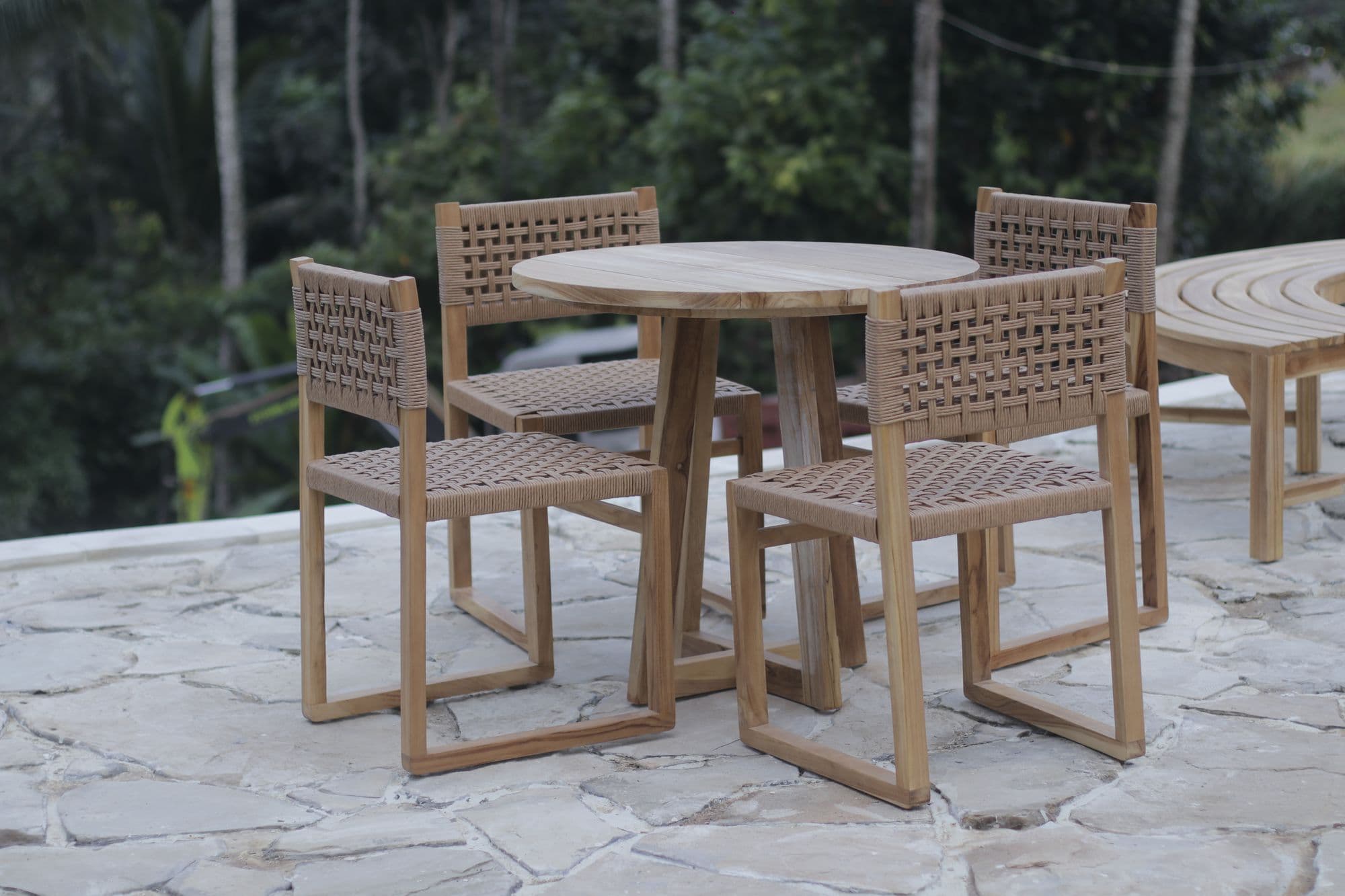 Teak table and chairs on the stone terrace